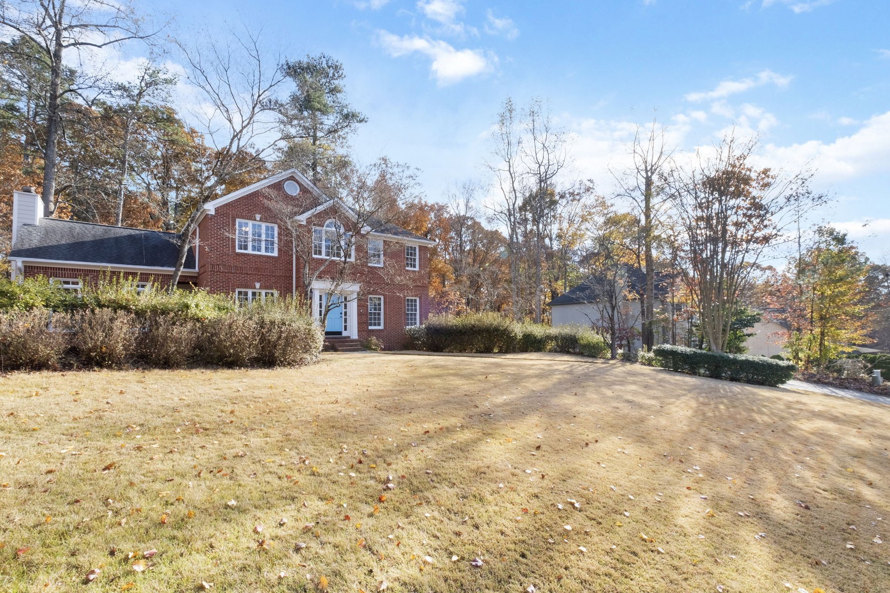 Front lawn and brick exterior from a side angle