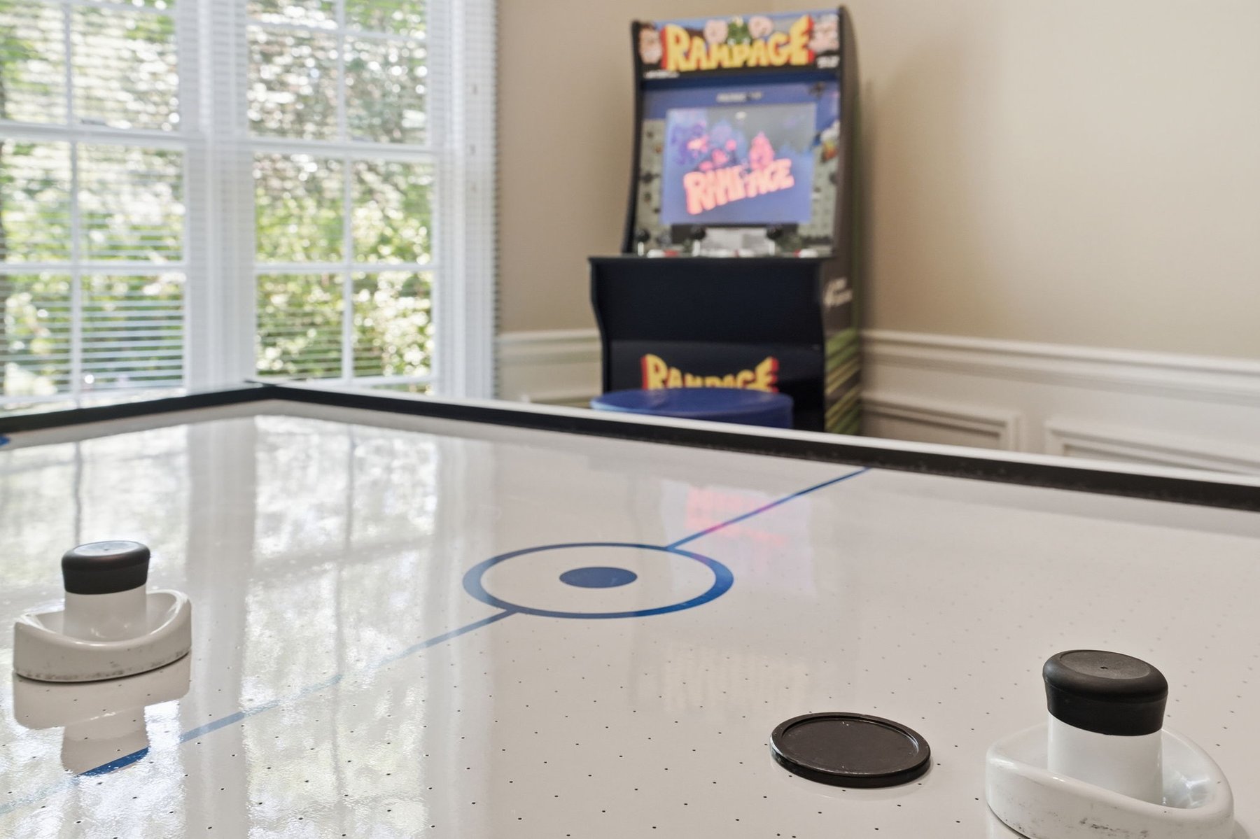 Game room with shuffleboard table