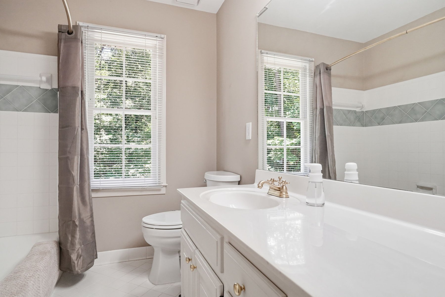 Bathroom with glass shower and vanity