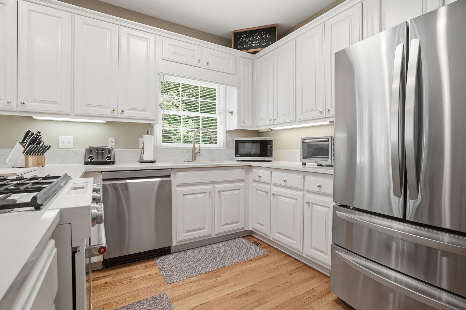 Kitchen with center island and stainless appliances