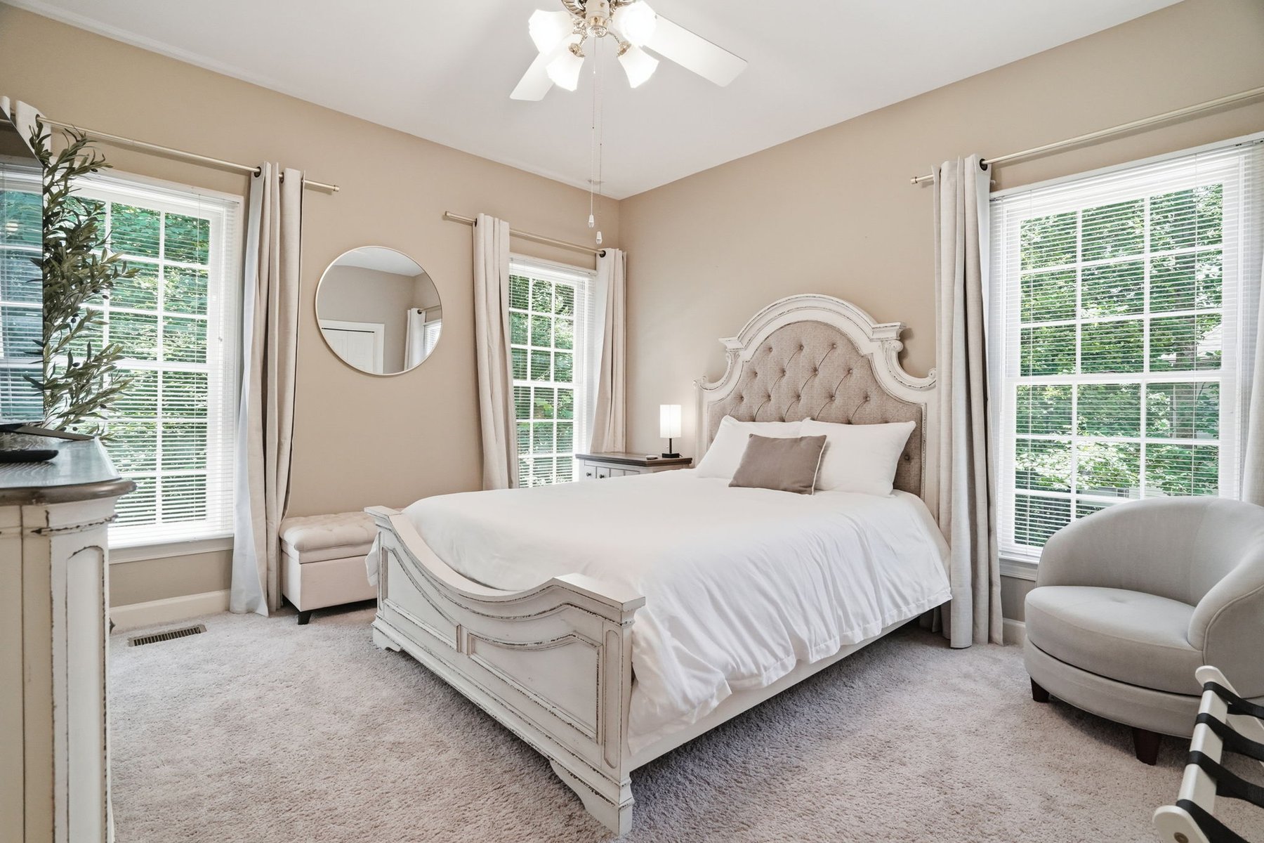 Primary bedroom at The Camden Grand with a furnished king bed